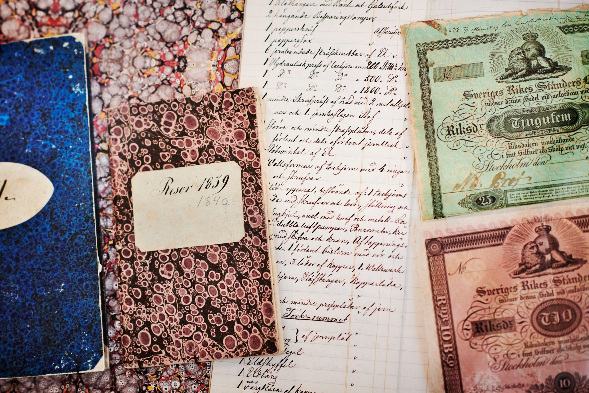 Notebooks and banknotes.