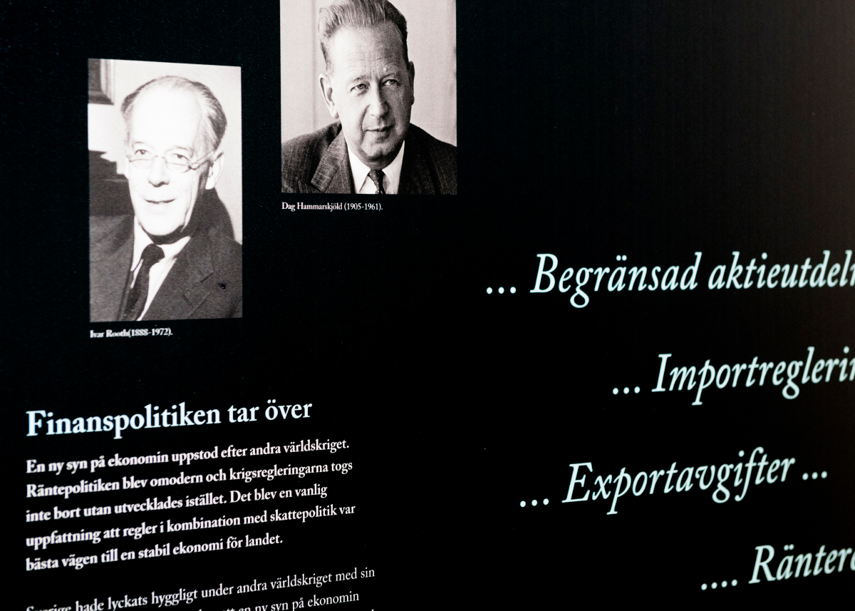An exhibition wall with text and images.
