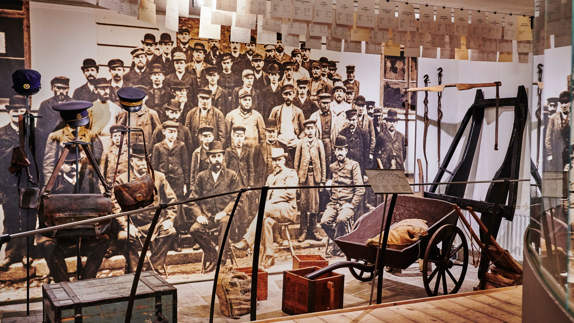 A picture on a wall showing men who worked at the paper mill. 