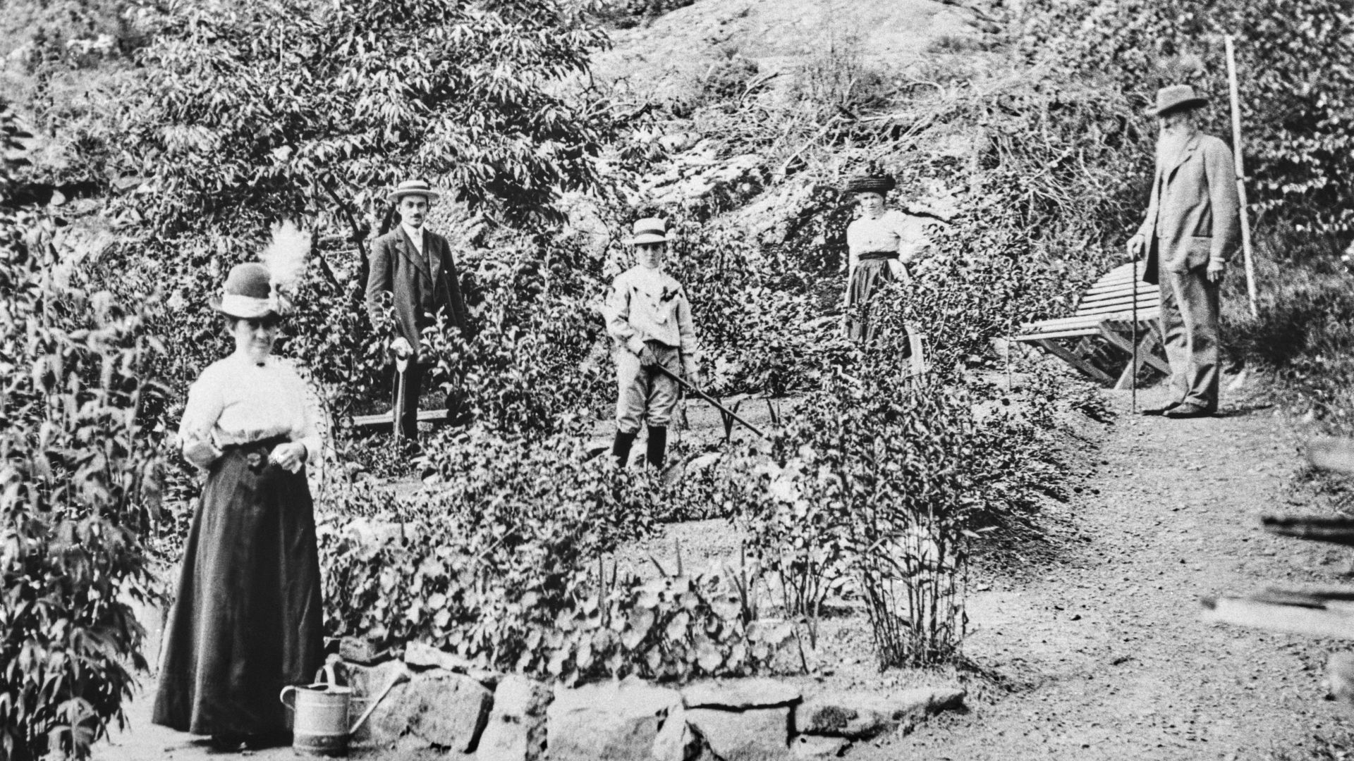 Family standing in a garden