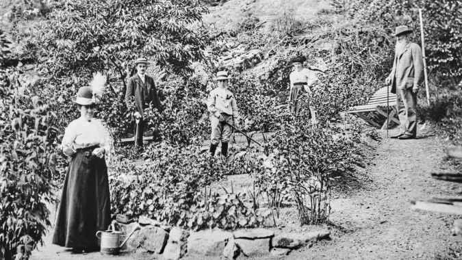 A family standing in a garden
