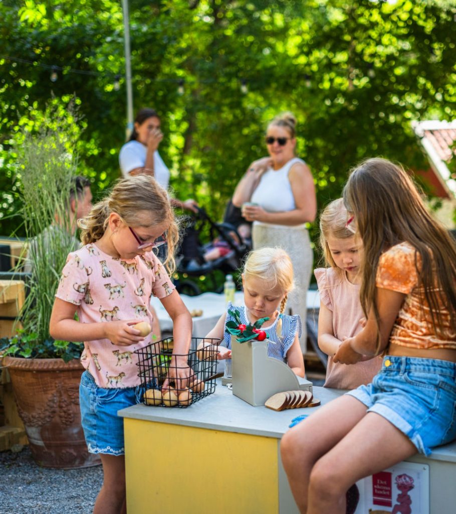 Children playing store outdoors