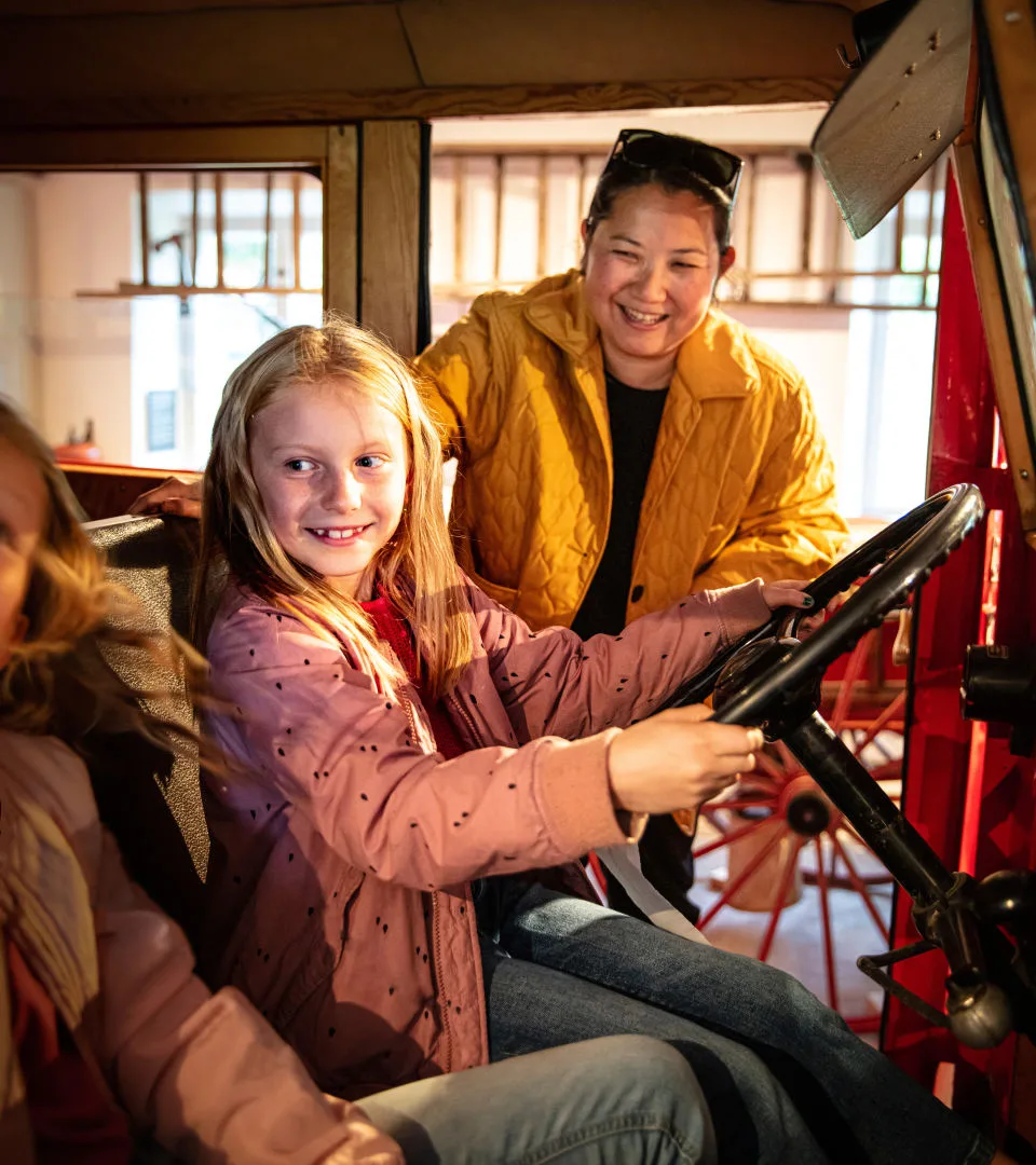 A child sitting in the fire truck